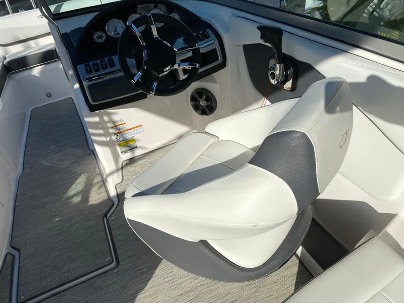 Slide: The Image of 2017 Regal 22 FasDeck boat interior with steering wheel and captain's chair. - 48