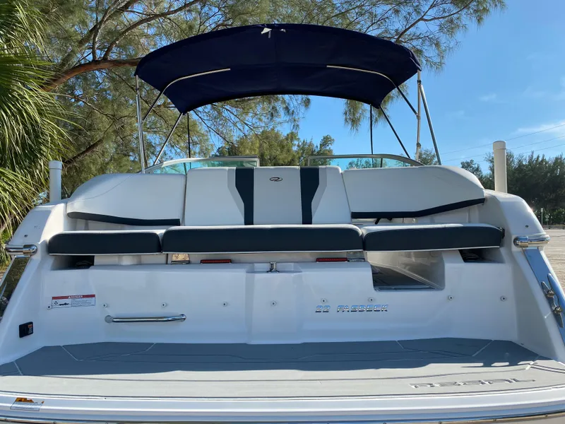 Slide: The Image of 2017 Regal 22 FasDeck boat with rear seating and canopy. - 5