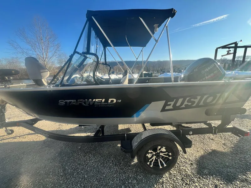 Slide: The Image of 2024 Starweld 18 Fusion boat with Yamaha outboard motor on a trailer. - 13
