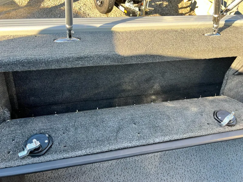 Slide: The Image of 2024 Starweld 18 Fusion boat interior storage compartment with carpeted finish. - 18