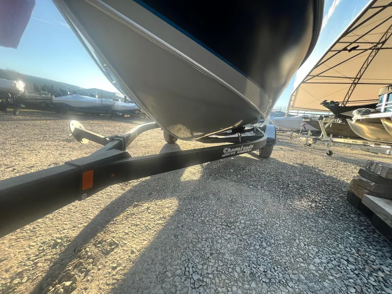 Slide: The Image of 2024 Starweld 18 Fusion boat on a ShoreLand'r trailer in a boatyard. - 21