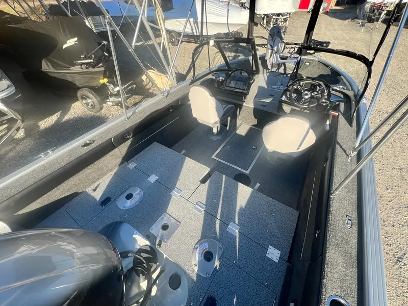 Slide: The Image of 2024 Starweld 18 Fusion boat interior with seating and control console. - 23