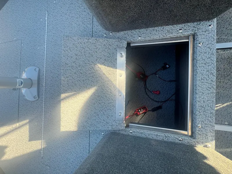 Slide: The Image of Open storage compartment on a 2024 Starweld 18 Fusion boat. - 29