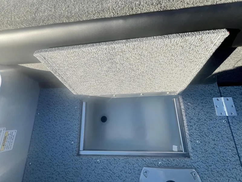 Slide: The Image of 2024 Starweld 18 Fusion boat storage compartment with open lid. - 3