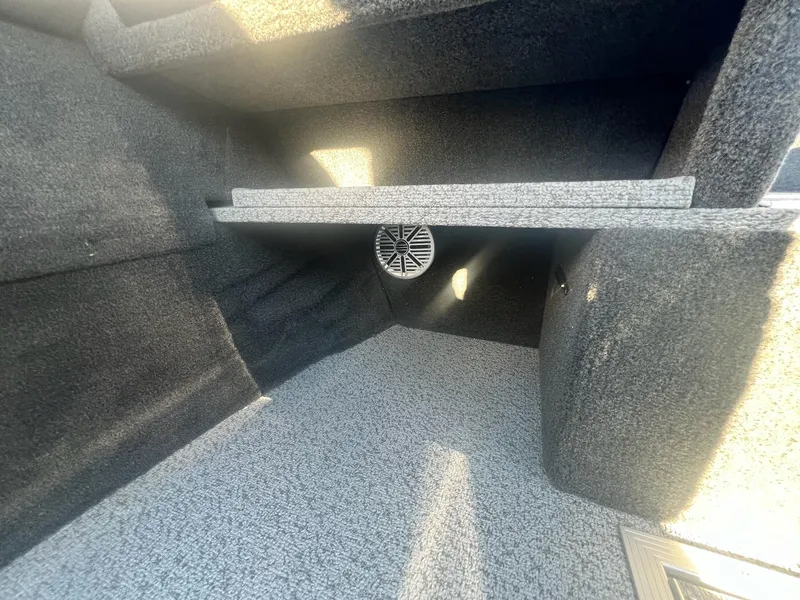 Slide: The Image of Interior of 2024 Starweld 18 Fusion boat with carpeted storage compartments. - 31