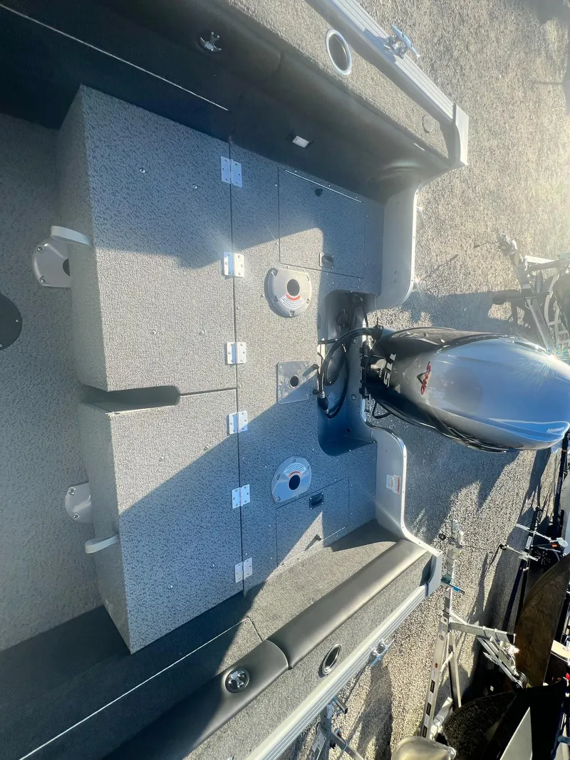 Slide: The Image of 2024 Starweld 18 Fusion boat interior with engine and storage compartments. - 34