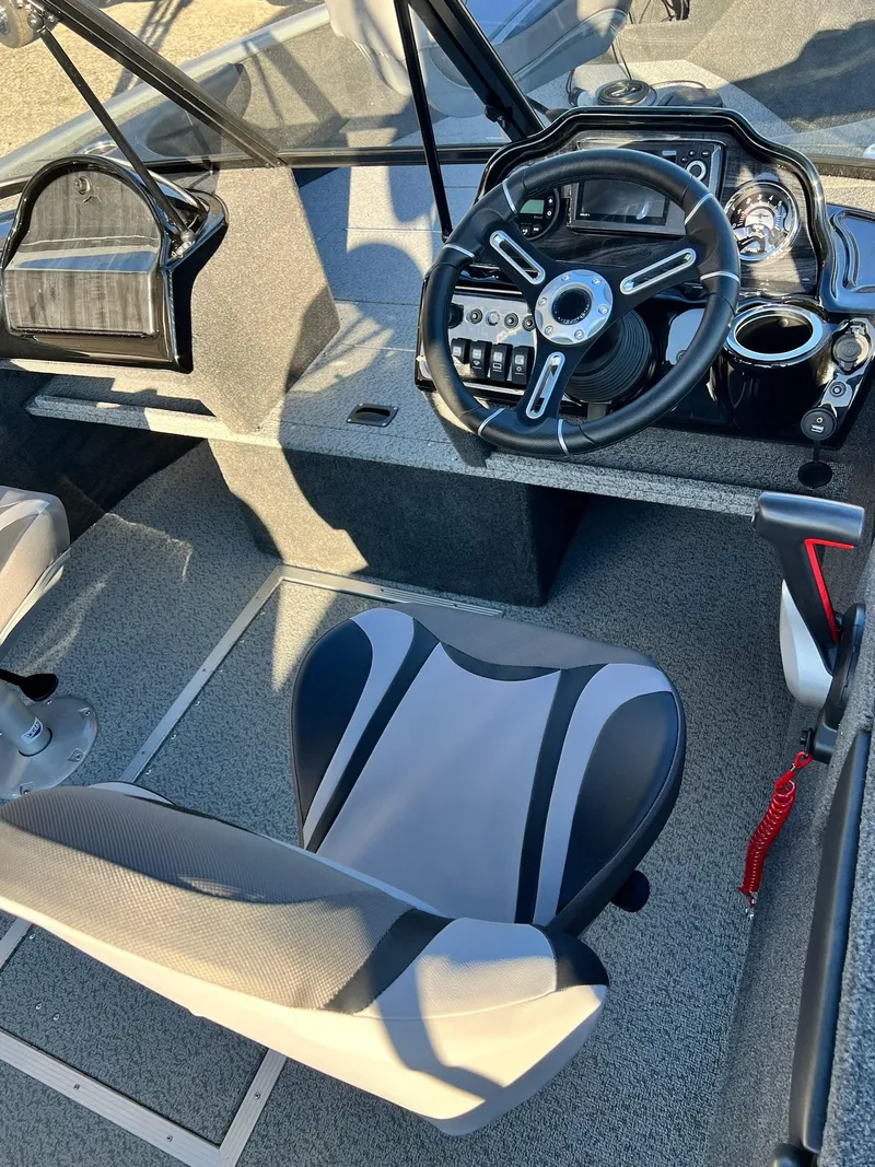 Slide: The Image of 2024 Starweld 18 Fusion boat interior with steering wheel and captain's seat. - 35