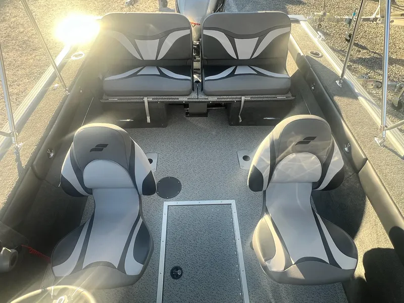 Slide: The Image of 2024 Starweld 18 Fusion boat interior with four gray and black seats. - 36