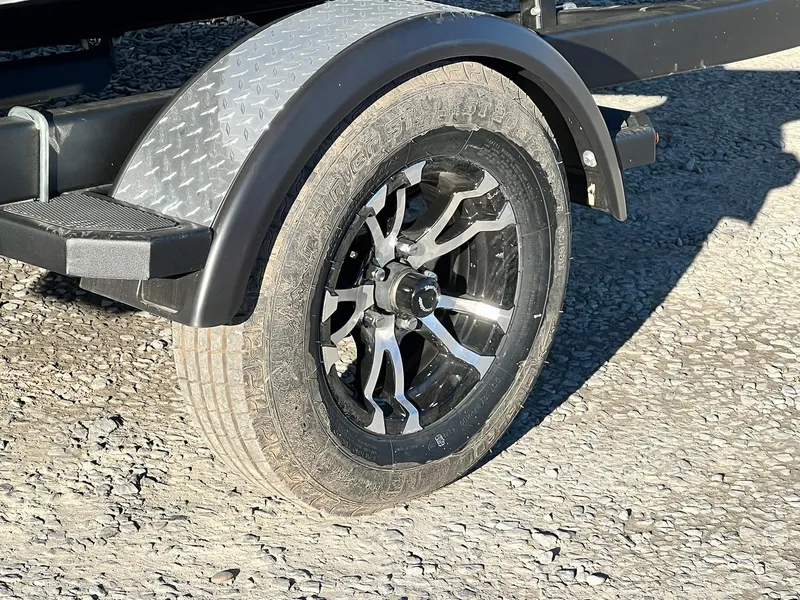 Slide: The Image of Close-up of a 2024 Starweld 18 Fusion trailer wheel and fender. - 37