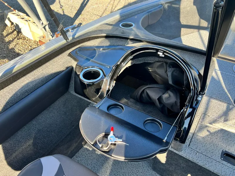 Slide: The Image of 2024 Starweld 18 Fusion boat interior with storage and cup holders. - 7