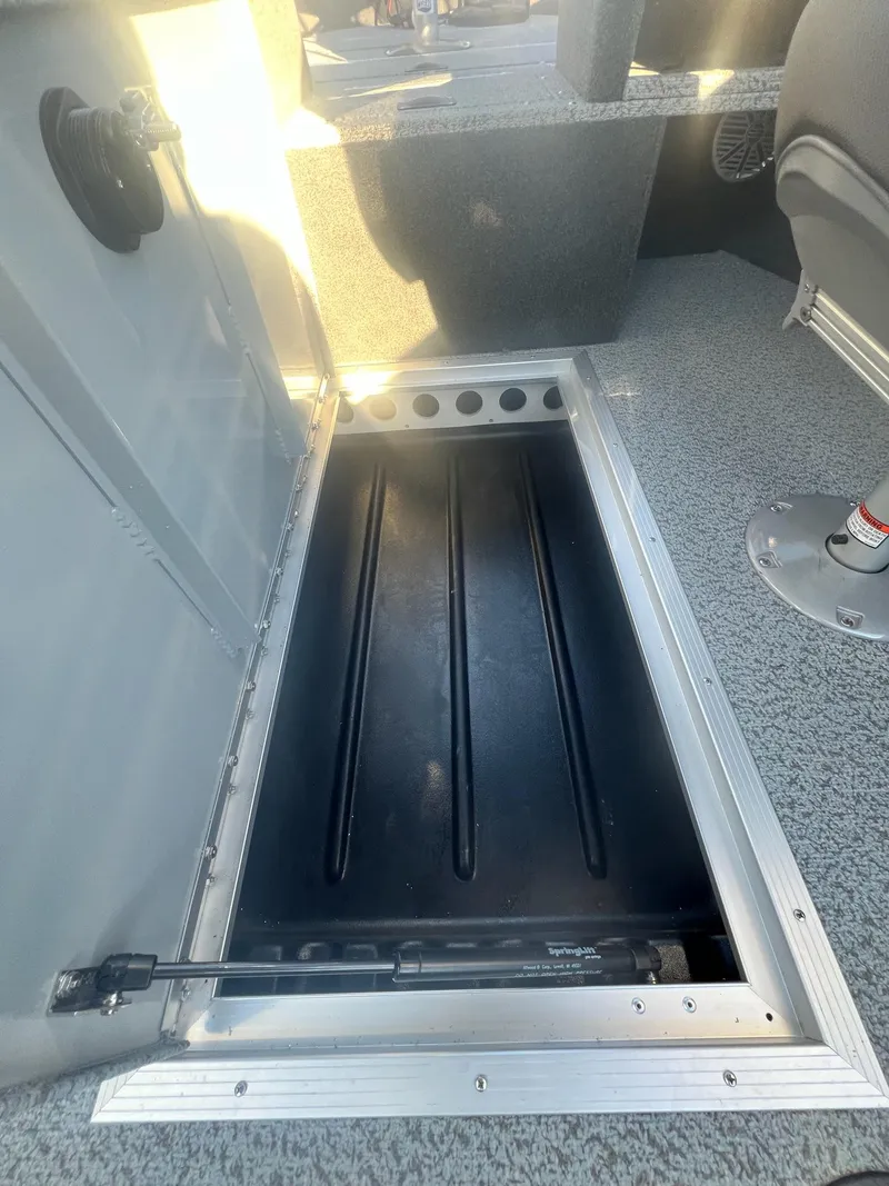 Slide: The Image of Starweld 18 Fusion 2024 boat storage compartment with open hatch. - 9
