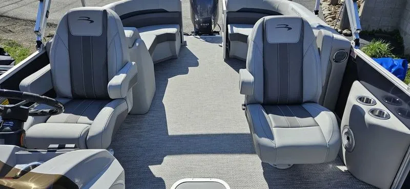 Slide: The Image of 2024 Bennington 22 SXSR boat interior with plush gray seating and modern design. - 3