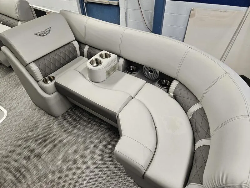 Slide: The Image of 2024 Bennington 22 LSAPG boat interior with luxurious gray seating and cup holders. - 5