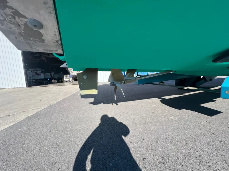 Slide: The Image of 2017 Back Cove Downeast 37 boat propeller and rudder on trailer. - 10
