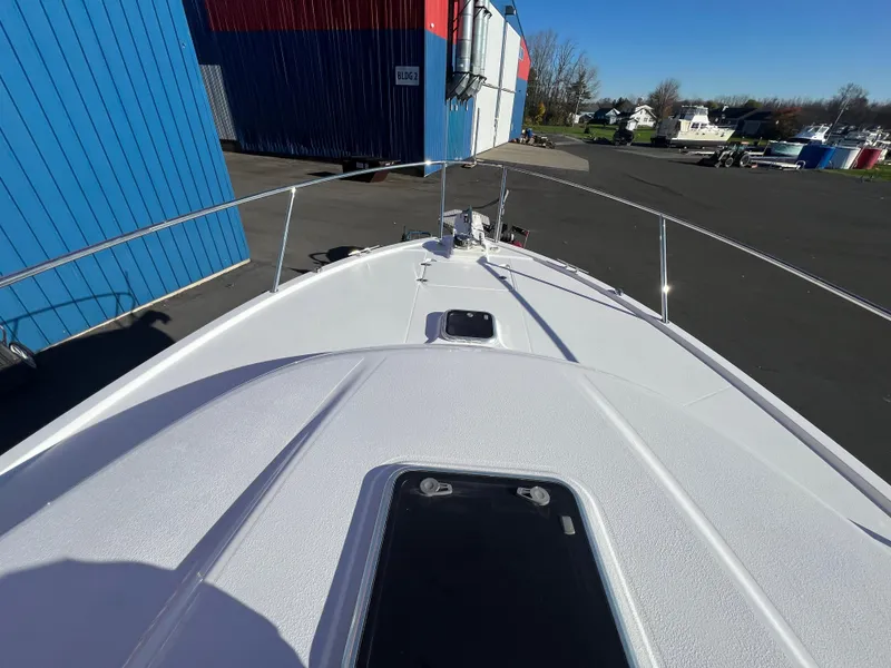 Slide: The Image of 2017 Back Cove Downeast 37 boat bow view in a marina. - 16