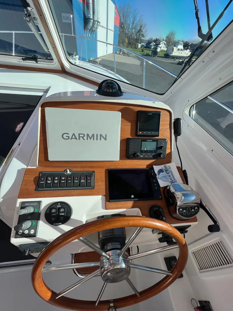 Slide: The Image of 2017 Back Cove Downeast 37 helm with Garmin navigation system. - 32