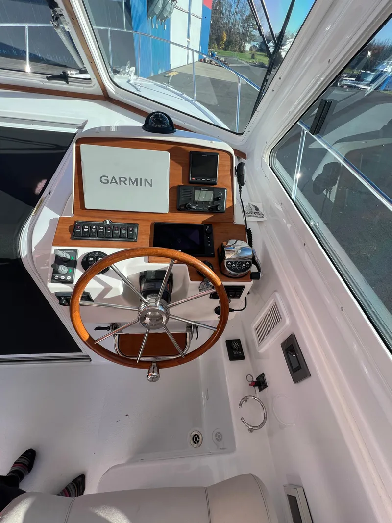 Slide: The Image of 2017 Back Cove Downeast 37 helm with Garmin navigation system. - 34