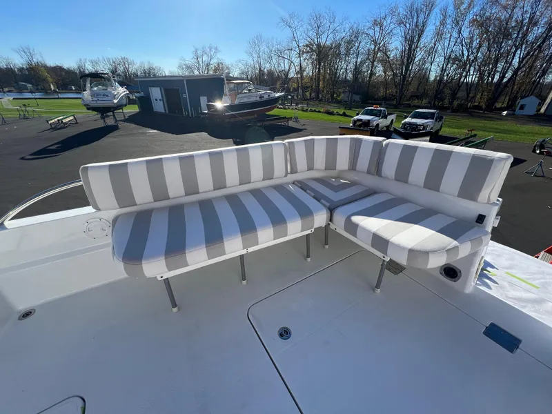 Slide: The Image of 2017 Back Cove Downeast 37 boat with striped outdoor seating. - 46