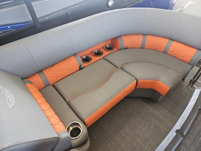 Slide: The Image of 2024 Bennington 24LFBC boat interior with gray and orange seating. - 3
