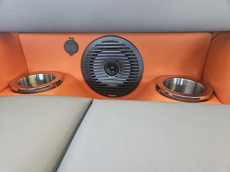 Slide: The Image of 2024 Bennington 24LFBC boat interior with speaker and cup holders. - 4