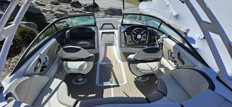 Slide: The Image of 2024 Monterey 224FS boat interior with modern seating and steering console. - 2