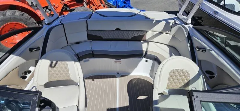 Slide: The Image of 2024 Monterey 224FS boat interior with beige seating and modern design. - 4