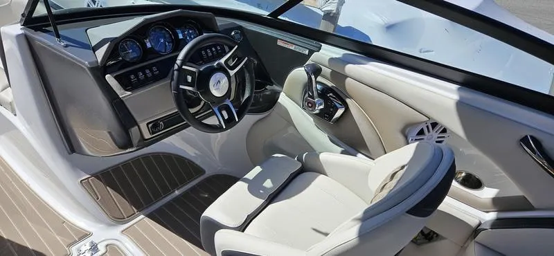 Slide: The Image of 2024 Monterey 224FS boat interior with modern dashboard and comfortable seating. - 5