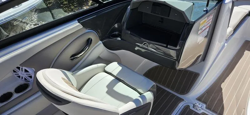 Slide: The Image of 2024 Monterey 224FS boat interior with seating and storage compartment. - 7