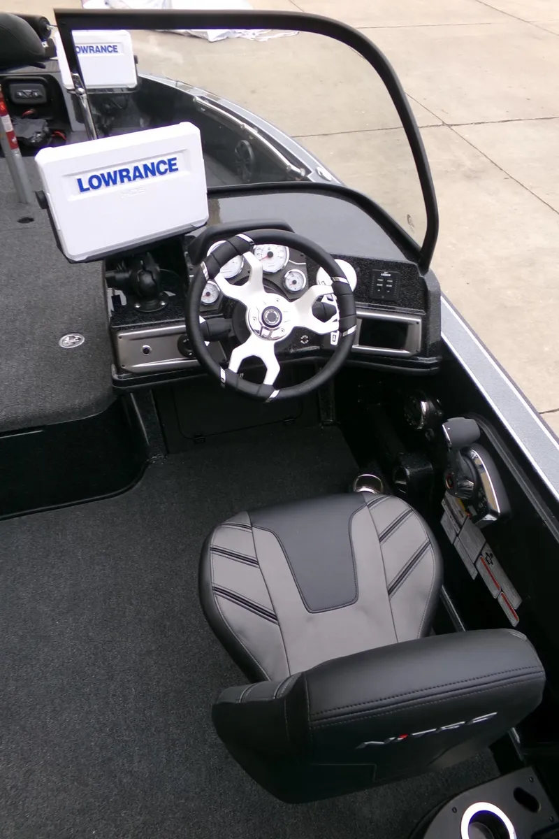 Slide: The Image of 2024 Nitro ZV20 Pro boat cockpit with Lowrance electronics and modern steering wheel. - 6