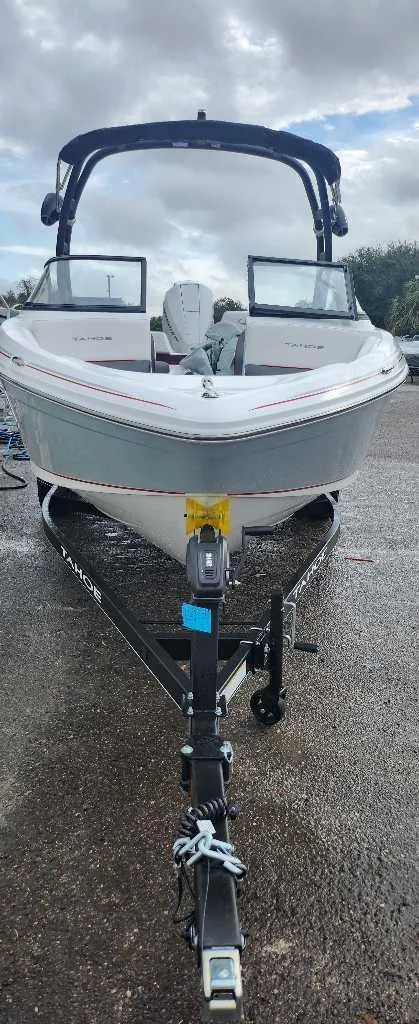 Slide: The Image of 2024 Tahoe 210 S boat on trailer, front view. - 1