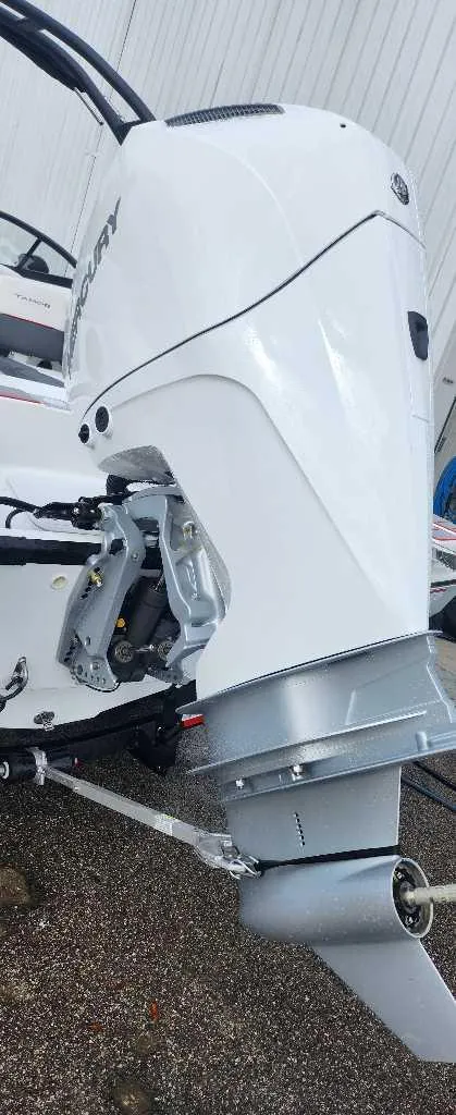 Slide: The Image of 2024 Tahoe 210 S boat engine close-up. - 2