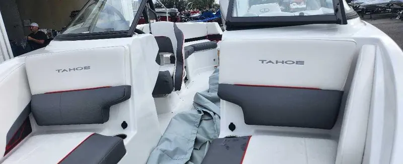 Slide: The Image of 2024 Tahoe 210 S boat interior with white and gray seating. - 6