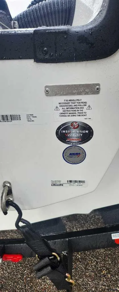 Slide: The Image of Alt text: 2024 Tahoe 210 S boat identification and certification labels on the hull. - 7