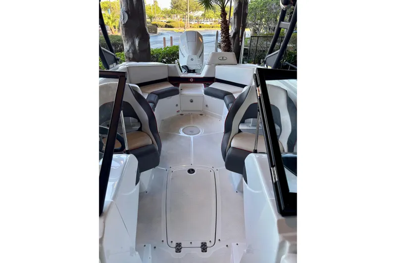 Slide: The Image of 2024 Tahoe 210 S boat interior with modern seating and sleek design. - 9