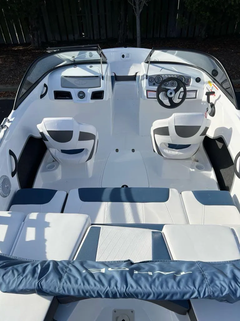 Slide: The Image of 2024 Tahoe 185 S boat interior with modern seating and steering wheel. - 4