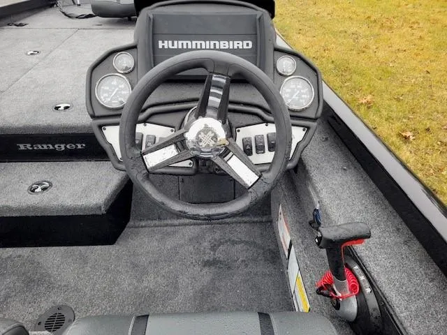 Slide: The Image of 2024 Ranger RT198P boat dashboard with Humminbird electronics and steering wheel. - 3