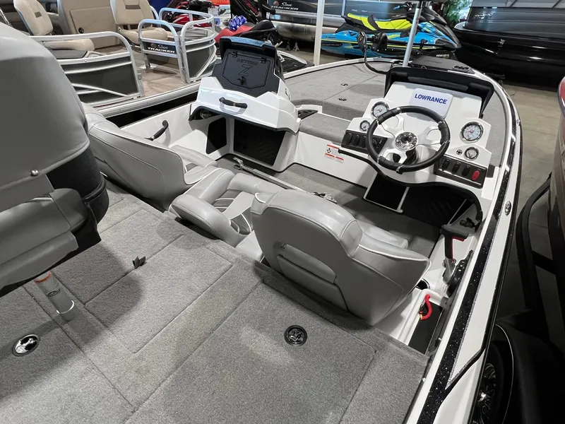 Slide: The Image of 2024 Nitro Z18 boat interior with steering console and seating. - 6