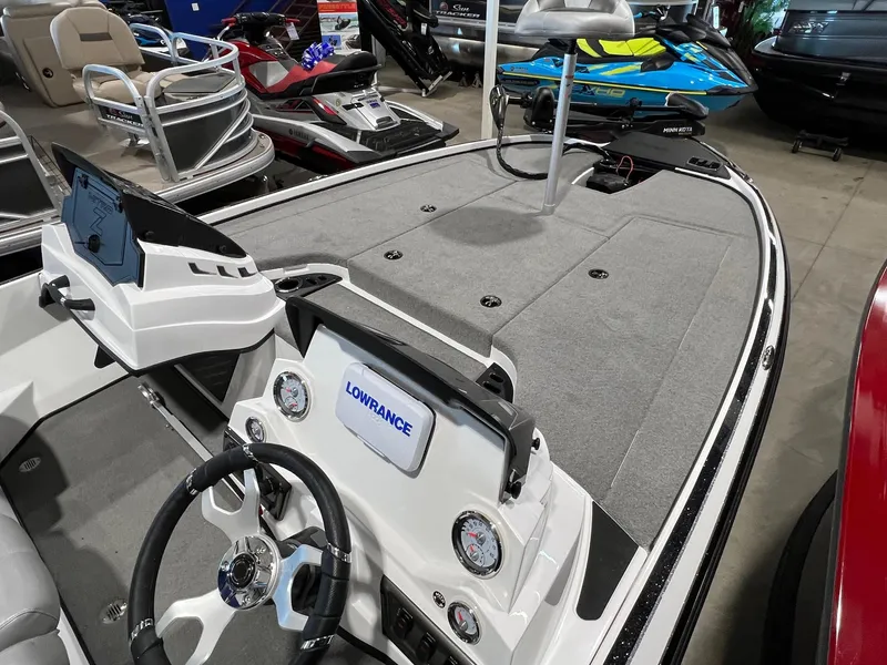 Slide: The Image of 2024 Nitro Z18 boat interior with Lowrance electronics and steering wheel. - 7