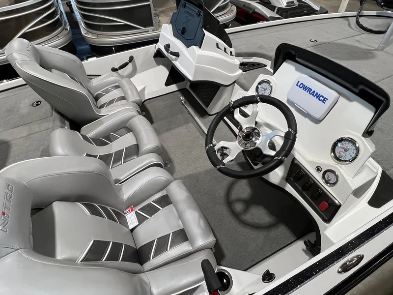 Slide: The Image of 2024 Nitro Z18 boat interior with Lowrance electronics and dual seating. - 8