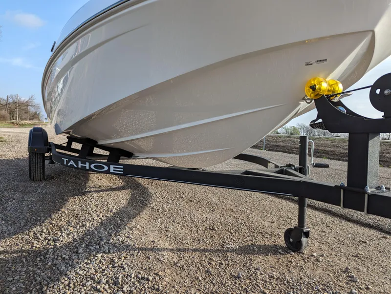 Slide: The Image of 2024 Tahoe T16 boat on trailer, close-up view. - 10