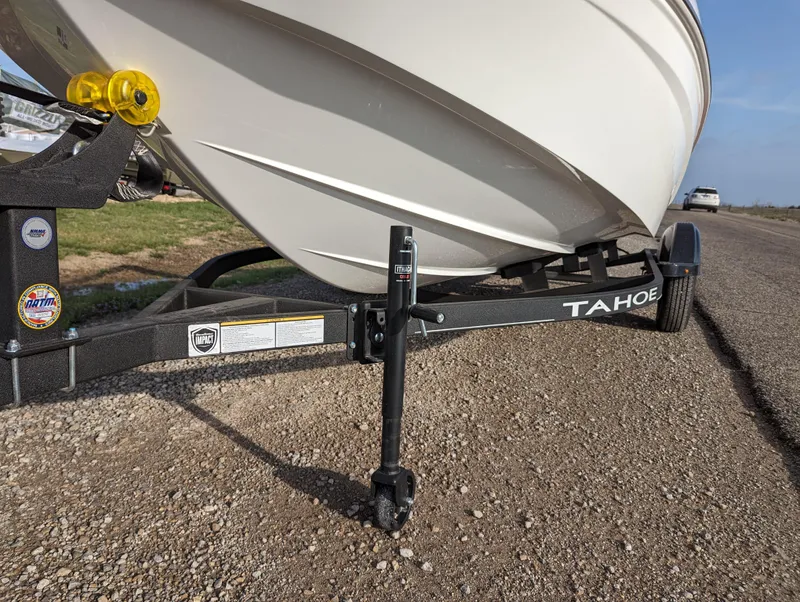 Slide: The Image of 2024 Tahoe T16 boat on trailer, close-up of front hull and hitch. - 11