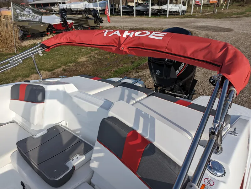 Slide: The Image of 2024 Tahoe T16 boat with red canopy and seating area. - 14