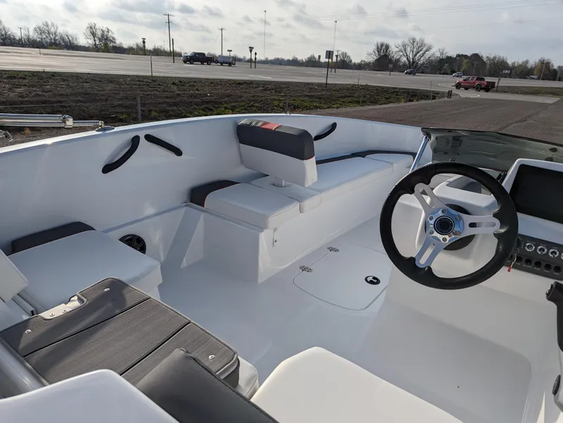 Slide: The Image of 2024 Tahoe T16 boat interior with seating and steering wheel. - 15