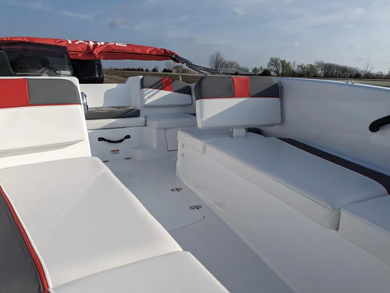 Slide: The Image of 2024 Tahoe T16 boat interior with white and red seating. - 18