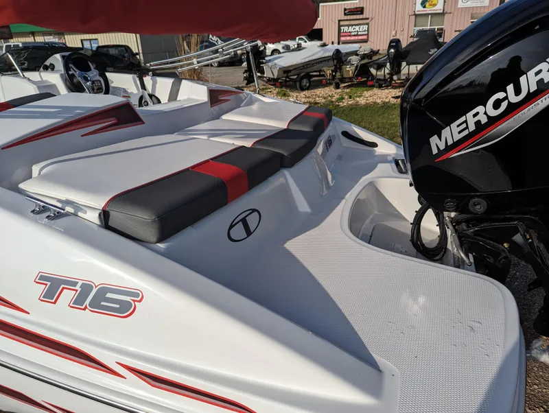 Slide: The Image of 2024 Tahoe T16 boat with Mercury engine, red and black seating, and sleek white design. - 19