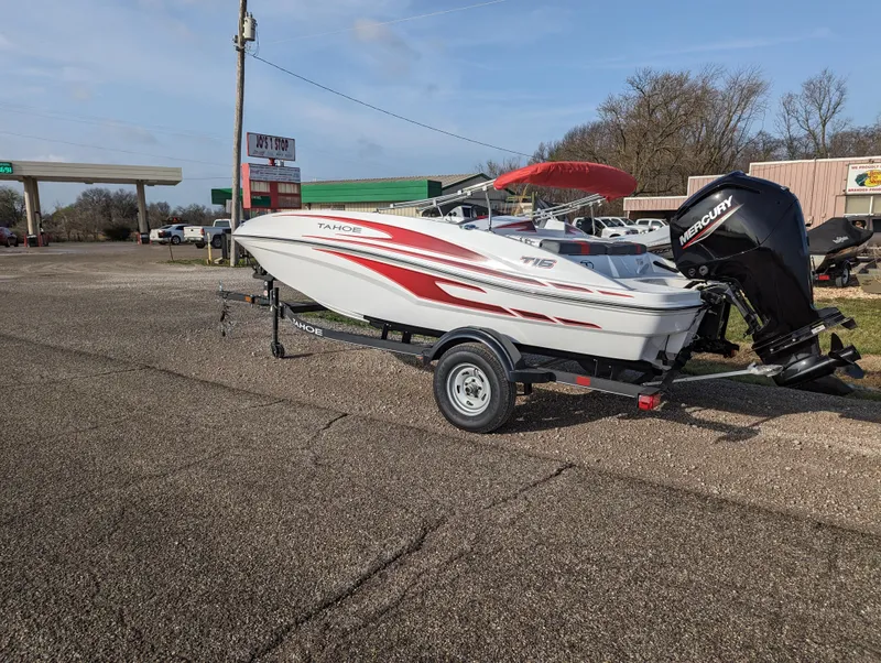 Slide: The Image of 2024 Tahoe T16 boat on trailer with Mercury outboard motor. - 3