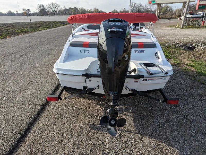 Slide: The Image of 2024 Tahoe T16 boat with outboard motor and red canopy, rear view. - 5