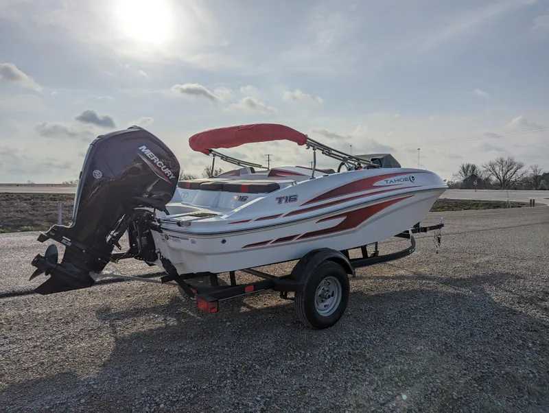 Slide: The Image of 2024 Tahoe T16 boat with Mercury outboard motor on trailer. - 7