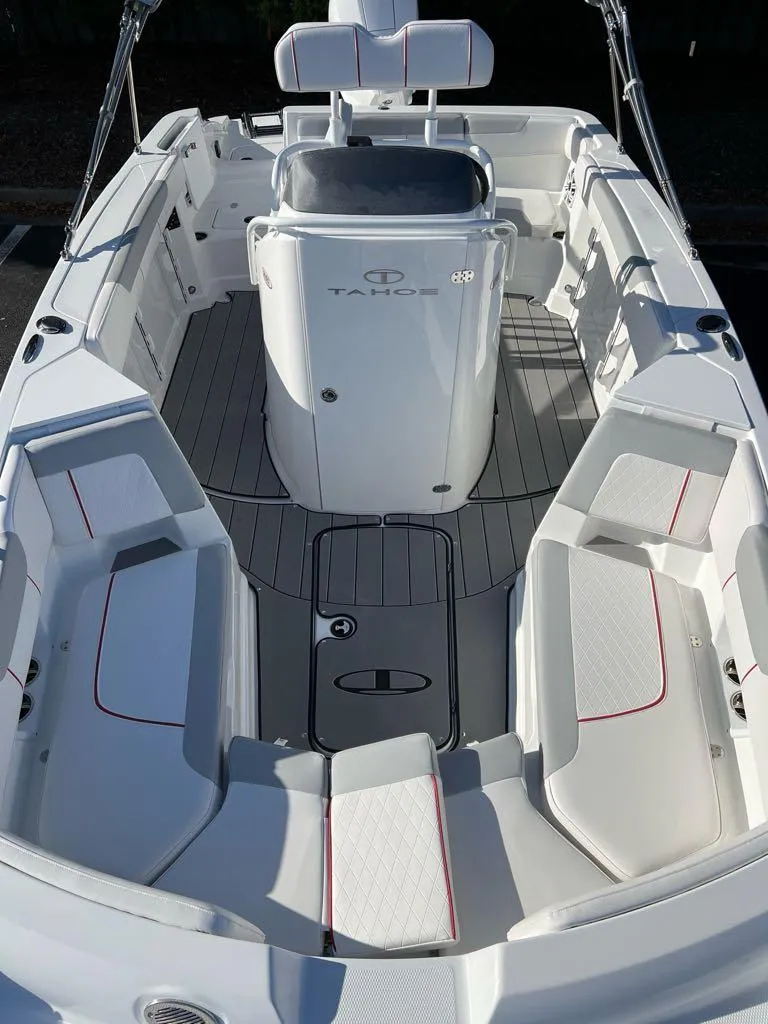 Slide: The Image of 2024 Tahoe 2150 CC boat interior with white seating and sleek design. - 4