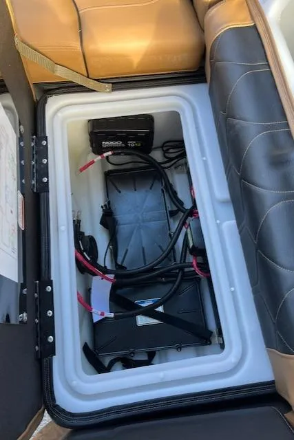 Slide: The Image of Battery compartment of a 2024 Regency 230 LE3 boat. - 23
